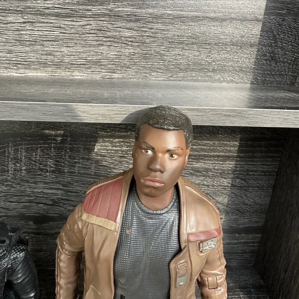 Star Wars action‎ figures Darth Vader, a TIE Fighter Pilot, Kylo Ren, and Finn